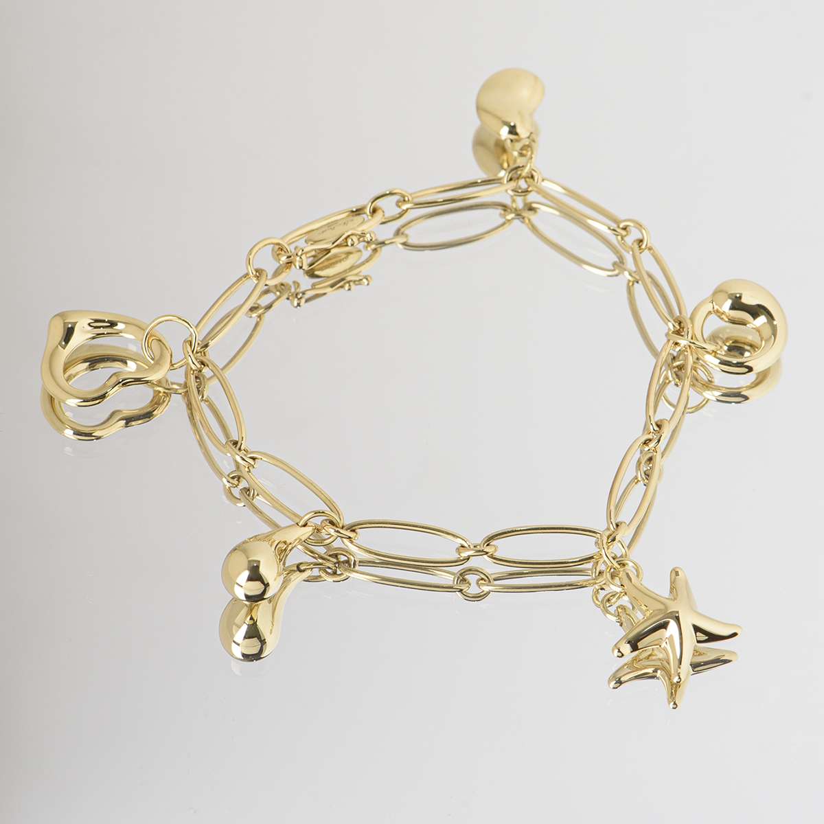 Tiffany and Co. Yellow Gold Elsa Peretti Charm Bracelet at 1stDibs